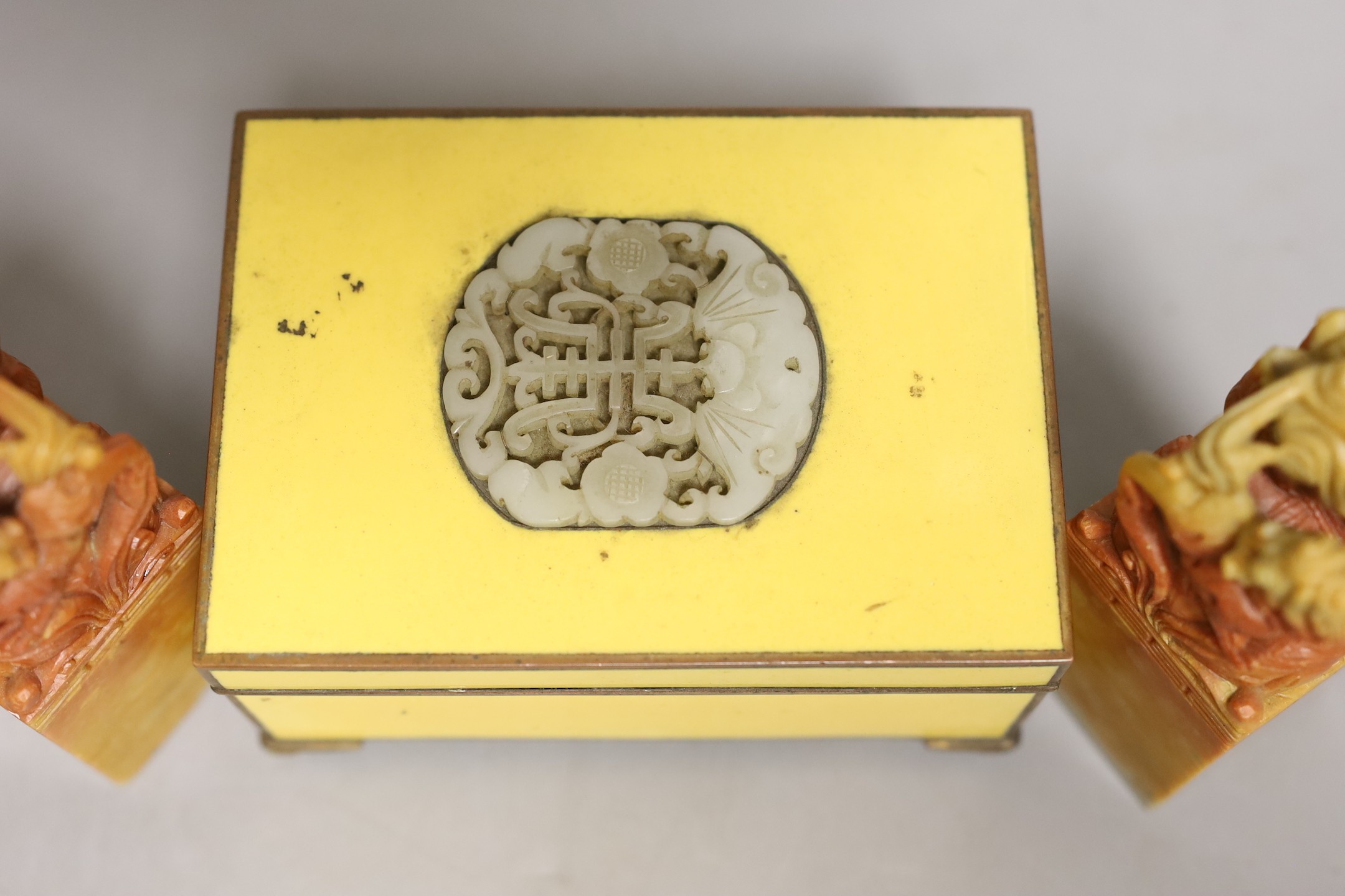 Two soapstone lion dogs and yellow enamelled box
